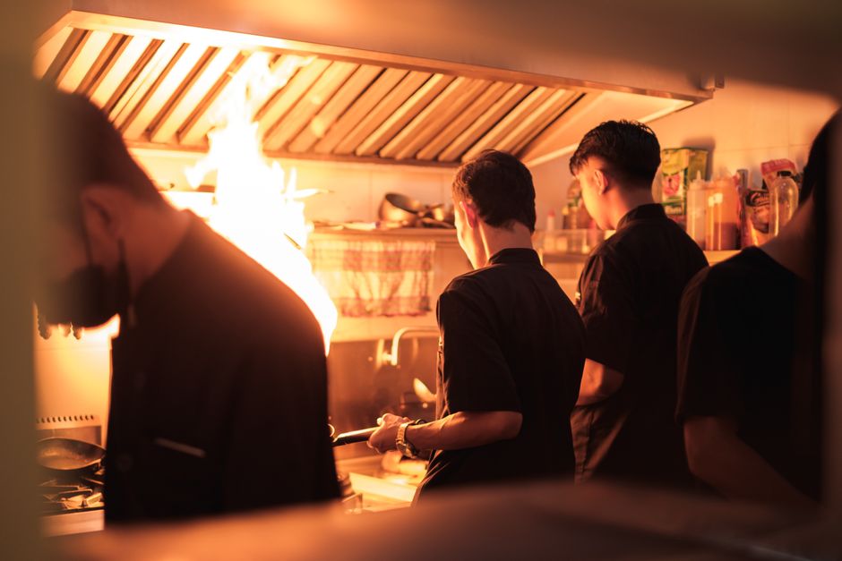 Busy restaurant kitchen during a high-volume dinner rush